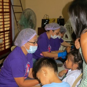 IAOMT dental staff and volunteers giving the Gota kids a check-up