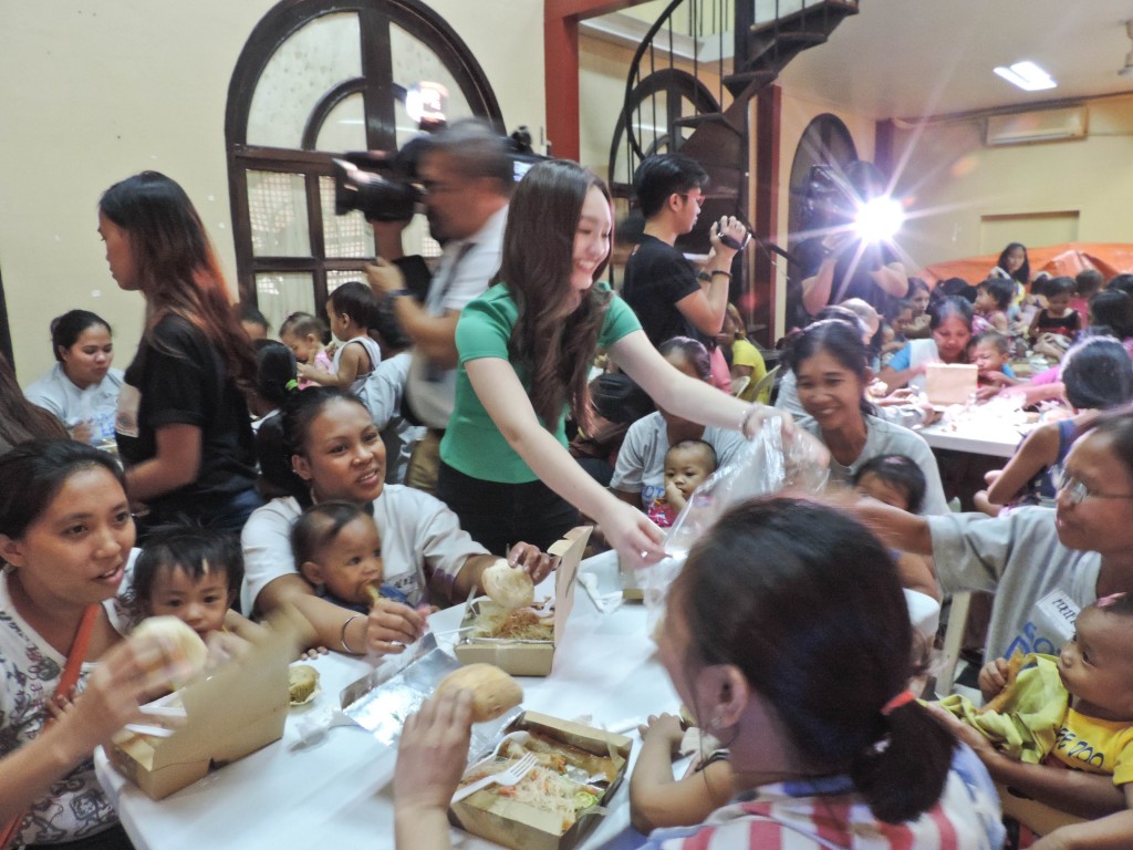 Myca distributes meals and treats to the happy moms