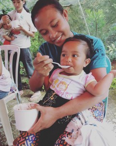 Kibungan mom feeding her baby a nutritious rice meal